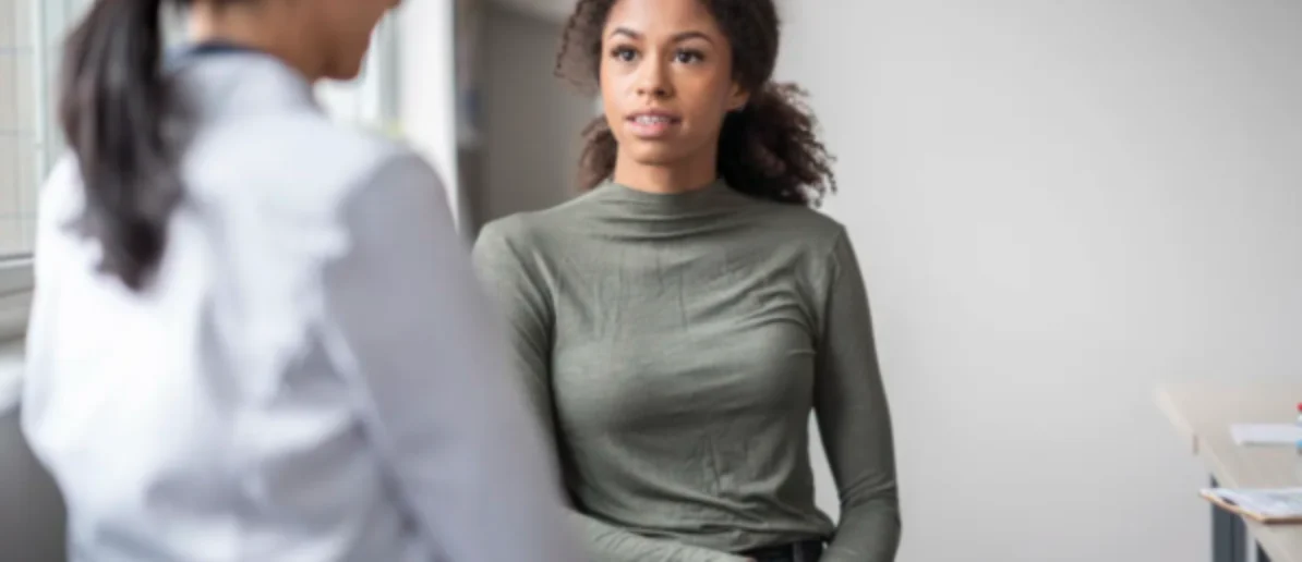 woman talking to a doctor looking concerned